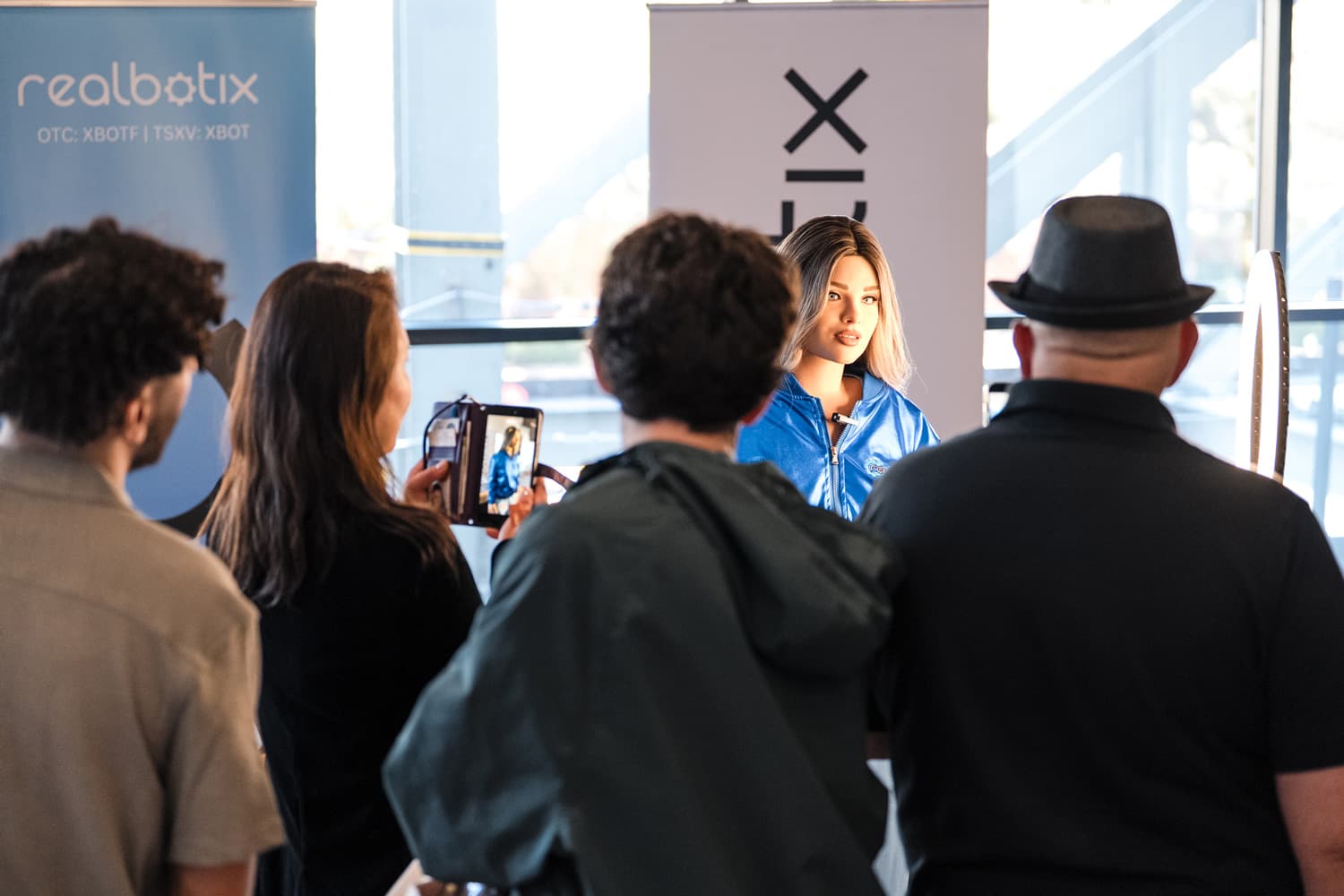 A crowd gathered around a Realbotix persona at a live event